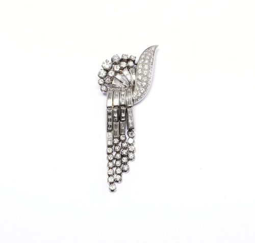DIAMOND CLIP BROOCH, ca. 1950. Platinum 900 and gold. Very fancy brooch with stylized flowers and band motifs set throughout with 38 baguette-cut diamonds weighing ca. 3.20 ct and 65 brilliant-cut diamonds weighing ca. 4.80 ct. Ca. 8.5 x 3.5 cm.
