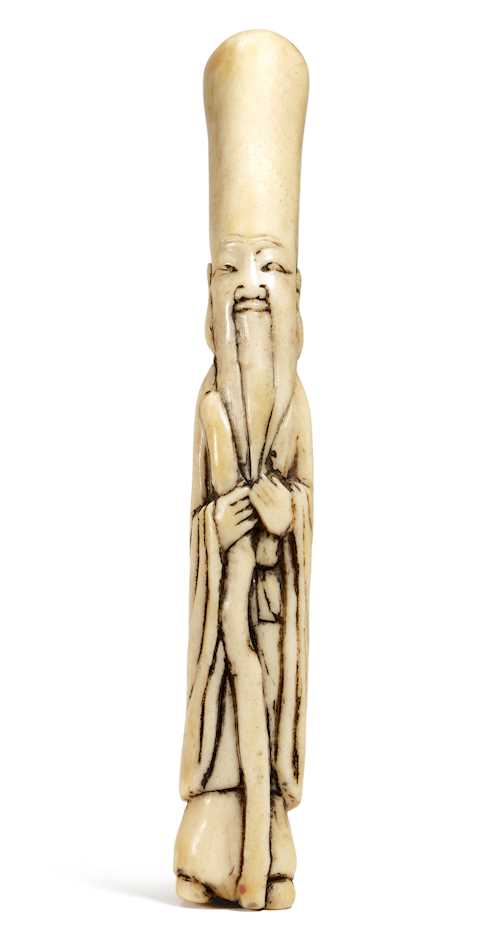A STAG ANTLER NETSUKE OF THE LUCKY GOD FUKUROKUJU.