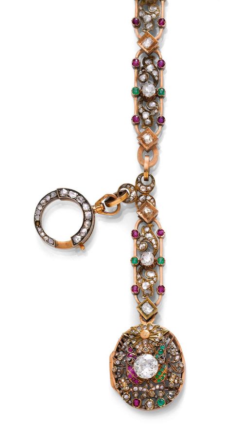 GEMSTONE AND GOLD CHAIN WITH OTTOMAN COAT OF ARMS, ca. 1900. Pink gold 585, 58g. Decorative necklace of 8 elliptical, open-worked links, each with 2 diamond-set acanthus leaves, 4 small rubies, 2 emeralds and 1 old European-cut diamond weighing ca. 1.20 ct in total, connected to one another by small gold lozenges each with 1 diamond, weighing ca. 0.70 ct in total. The lower part: an oval, open-worked medallion with the Ottoman coat of arms, the centre set with 1 old European-cut diamond weighing ca. 1.50 ct and decorated with numerous rubies, emeralds and rose-cut diamonds. On a diamond-set curb link chain with a split ring clasp. Bottom of the medallion, missing. L ca. 33.5 cm.