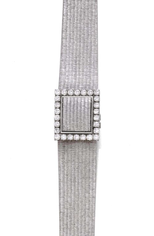 DIAMOND AND GOLD LADY'S WRISTWATCH, PATEK PHILIPPE for GÜBELIN, 1970s. White gold 750, 78g. Ref. 3317/1. Elegant, textured wristwatch with cover. Square case No. 2663209 with brilliant-cut diamond lunette weighing ca. 1.30 ct and convex, textured sprung cover. Silver-coloured dial with Roman numerals and hands. Hand winder, movement No. 998128 with Gyromax balance. Decorative, textured original gold band with brick pattern, L ca. 18 cm. D 22 x 19 mm.