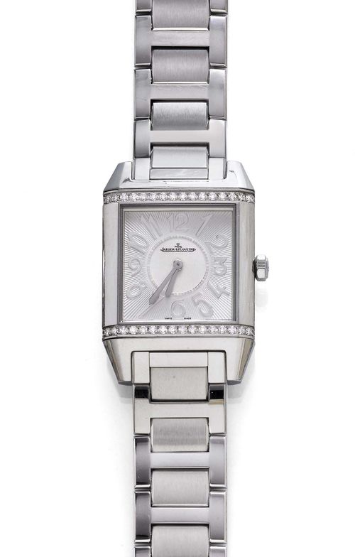 DIAMOND LADY'S WRISTWATCH, JAEGER LECOULTRE, REVERSO SQUADRA. Steel. Ref. 234.8.47. Square case No. 2621721 with brilliant-cut diamond lunette. Engine-turned dial with applied Arabic numerals and silver-coloured hands. Quartz movement, Cal. 657. Steel band with fold-over clasp. D 42 x 29 mm. With copy of the estimate, October 2009, and 1 extension link.
