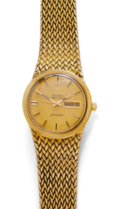 GENTLEMAN'S WRISTWATCH, AUTOMATIC, OMEGA SEAMASTER, 1970s. Yellow gold 750, 127g. Ref. 166.032 and 168.023. Round case with screw-down back and flat lunette. Gold-coloured dial with black painted indices and hands, window with month and day at 3h. Plexiglass. Automatic, movement No. 28009192, Cal. 751/1. Gold band with braided pattern, extension not original. L ca. 19 cm. D 36 mm.