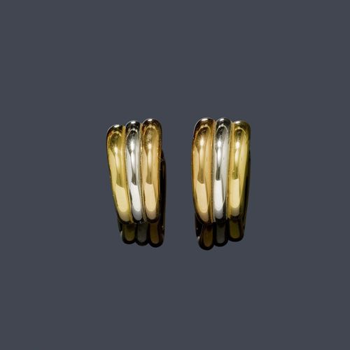 GOLD EAR CLIPS, CARTIER. White and yellow gold 750, 33g. Casual, slightly convex, bicolour Creole ear clips, each of 3 ring motifs. Signed Cartier 1994, No. E19707.