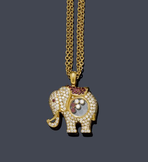 DIAMOND AND RUBY NECKLACE, CHOPARD HAPPY DIAMONDS, ca. 1985. Yellow gold 750, 34g. Very decorative pendant designed as an elephant, set throughout with numerous brilliant-cut diamonds weighing ca. 1.60 ct, the saddle additionally pavé-set with 30 rubies, 1 missing, and 1 small ruby as the eye. The belly set with 3 movable brilliant-cut diamonds weighing ca. 0.15 ct and 2 rubies. Signed Chopard LUC, engraving on the rear. On a double-row anchor chain, signed Chopard LUC. L ca. 53 cm.