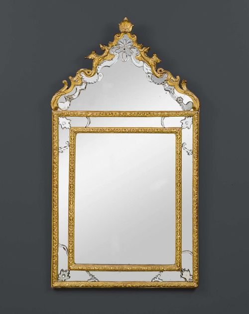 MIRROR "AUX DRAGONS", Baroque, German circa 1720. Richly carved and gilt wood. H 133 cm. W 70 cm. Expertise by Cabinet Dillee, Guillaume Dillee/Simon Pierre Etienne, Paris 2012.
