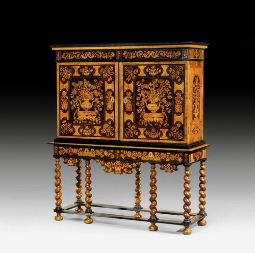 IMPORTANT CABINET "A FLEURS",Louis XIII, probably by J. VAN MEKEREN (Jan van Mekeren, Tiel 1658-1733 Amsterdam), The Netherlands circa 1695/1700. Tulipwood, purpleheart, olivewood, rosewood, sycamore and various precious woods with exceptionally fine inlays and partly ebonized. Double-door front above 2 adjacent drawers. The interior with 2 adjacent drawers. Gilt bronze mounts. Cracks and some areas of loss to the veneer. Some supplements. 167x56x192 cm.