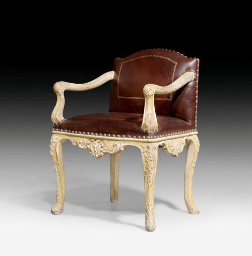 PAINTED FAUTEUIL "A LA REINE", Louis XV, German circa 1730/40. Beech exceptionally finely carved on all sides and painted off-white/yellow. Brown, parcel gilt, leather cover with decorative nailwork. 63x57x44x90 cm. Provenance: from a French collection. Expertise by Cabinet Dillee, Guillaume Dillee/Simon Pierre Etienne, Paris 2012.