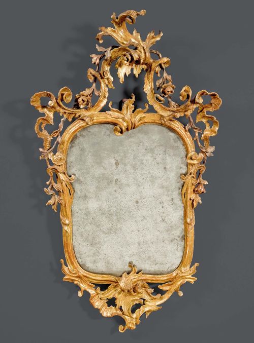 CARTOUCHE MIRROR,Louis XV, Venice circa 1760. Pierced and finely carved giltwood. Old mirror plate. H 90 cm. W 49 cm.