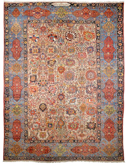 BACHTIAR PALACE CARPET antique.Beige central field patterned throughout with colourful, large trailing flowers and palmettes, light blue border with floral cartouches, good condition, small worn part to be restored, 450x665 cm.
