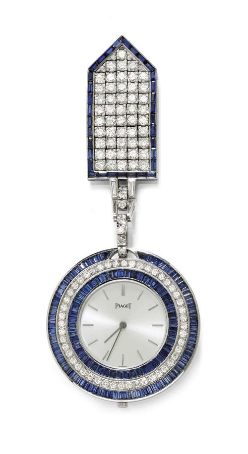 SAPPHIRE AND DIAMOND TUXEDO WATCH WITH PENDANT, PIAGET, ca. 1976. White gold 750, 61g. Flat case No. 5, the back textured, the lunette set throughout with 48 brilliant-cut diamonds weighing 1.25 ct and 138 baguette-cut sapphires weighing 11.52 ct. Silver-coloured, satin-finished dial with gold indices and gold hands. Ultra-flat movement No. 654909, Cal. 9P, gold pallet and escapement wheel, signed. Pendant set throughout with 61 brilliant-cut diamonds weighing 4.50 ct framed by 33 baguette-cut sapphires weighing 4.00 ct. Attache additionally decorated with 4 baguette-cut diamonds weighing 0.35 ct. D 42 mm. With case and copy of certificate by Bucherer, August 1976.