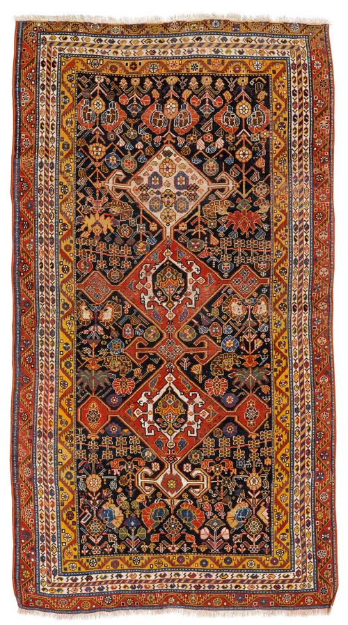 GASHGAI antique.Dark central field with a bar medallion, patterned with stylized plant motifs, stepped edging, signs of wear, 130x220 cm.