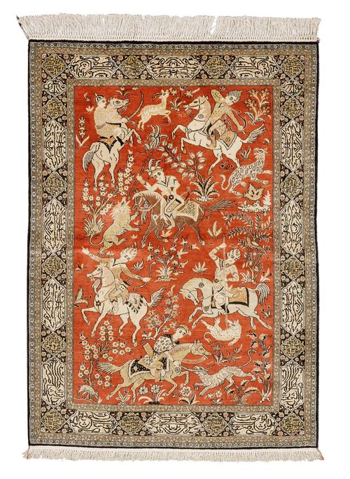 GHOM SILK.Dusky pink central field depicting hunting scenes, black edging with inscriptions, 111x164 cm.