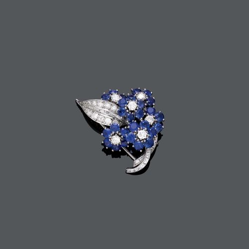 SAPPHIRE AND DIAMOND CLIP BROOCH, BOUCHERON, London. Platinum 950. Attractive elegant clip brooch designed as a bouquet of flowers, the blossoms set with 28 sapphires weighing ca. 5.00 ct in total and 6 brilliant-cut diamonds weighing ca. 0.70 ct in total, the leaf and the stem set throughout with numerous baguette-cut diamonds and brilliant-cut diamonds weighing ca. 1.10 ct in total. Signed Boucheron London, No. 2396. Mechanical part in white gold. Ca. 4 x 3 cm.