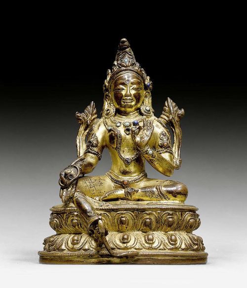 A GILT COPPER FIGURE OF THE GREEN TARA WITH STONE INLAYS. Tibet, 14th/15th c. Height 12 cm. Sealed.
