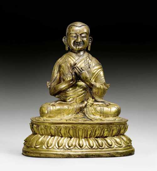 A FINE AND HEAVY GILT BRONZE FIGURE OF TSONGKHAPA. Tibeto-chinese, Qianlong period, height 31.5 cm. Lotus flowers and consecration plate lost.