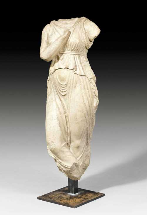 TORSO OF A DANCER, Hellenistic/Roman, eastern Mediterranean area, circa 1st century BC - 1st century AD. Gray/beige marble. Mounted on an iron plate. H 125 cm. Provenance: - Piasa Paris auction on 2.10.2003 (Lot No. 422). - From a Paris collection.