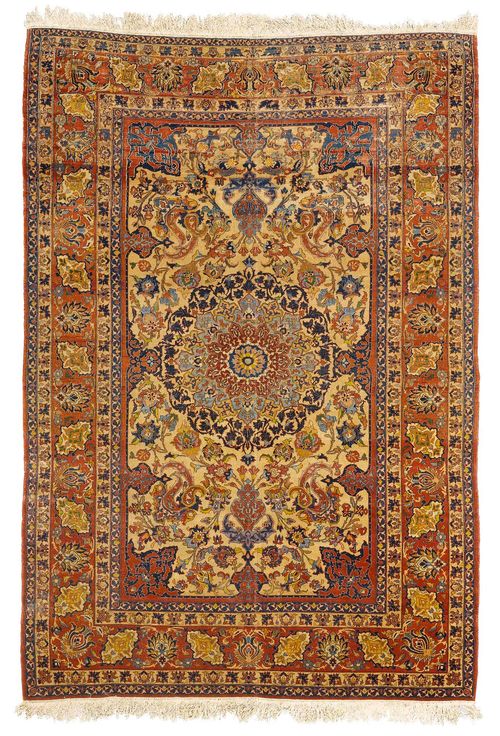 ISFAHAN old.With a white central field and central medallion, red corner motifs, finely patterned with flowers and palmettes and with a red border. With areas of heavy wear, 150x220 cm.