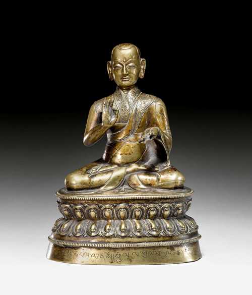 A FINE BRONZE FIGURE OF THE SAKYA MASTER ZHANG KÖNCHOG PÄL (1240-1317). Tibet, 16th c. Height 21 cm. Inscription at base. Commissioned by two persons of Chölung monastery, founded in the 16th century and converted to a Gelug monastery in the mid 17th century.