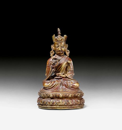 A BRONZE FIGURE OF PADMASAMBHAVA. Tibet, ca. 17th c. Height 14.5 cm. The tantric kathvanga is missing.