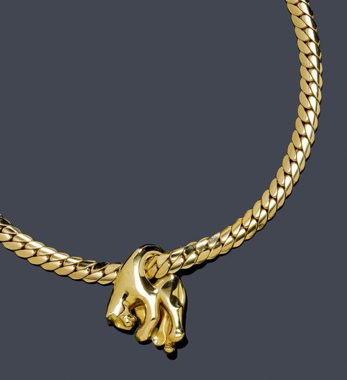 GOLD PENDANT WITH NECKLACE, CARTIER. Yellow gold 750, 95g. Panthère pendant with Gourmette chain, Ref. 70/81876. Decorative pendant designed as a sculptured panther, mounted on a casual-elegant curb link necklace, signed Cartier No. 613.06, L ca. 40 cm. With copy of insurance estimate, 1991.