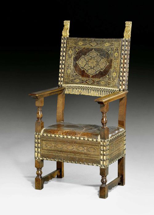 ARMCHAIR, Renaissance, Florence ca. 1580. Walnut, shaped and partly gilt. Brown, gold-stamped leather lining. 64x48x49x116 cm. Provenance: private collection, Lugano. Lit.: M. Cera, Il mobile italiano, Milan 1983; page 214 (fig. 396).