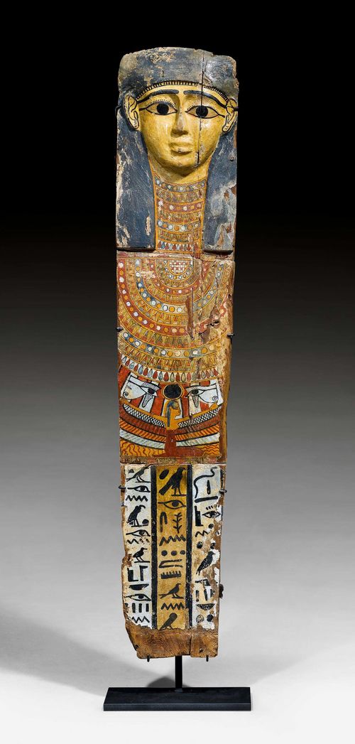 PAINTED SARCOPHAGUS COVER, 25th Dynasty, Egypt, ca. 664-332 BC. Finely painted wood with the winged Goddess Nephthys with "Ousekh" necklace and hieroglyphics; "Paroles dites par l'Osiris Khenou, qui a fait le dieu de chacun. (Le) fils de Horus qu'a donné Sousenoumenou de M... (Sousenoumenou est le nom de son père). Celle qu' donné Mout, qui a donné Horus, l'Osiris divin, la maîtresse de (la demeure) Iroun...". Rectangular. Minor losses. Mounted on a metal frame. H 165 cm. Provenance: - formerly in a private collection, Bourgogne. - Galerie G. Moreau, Toulouse. - Auction Tajan, Paris, 8 February 2008 (Lot No. 166;  expert A. Tarantino, Paris) - Auction Auxerre Enchères, 14 September 2013 (Lot No. 13; expert M. Cohen, Paris). - from a Swiss collection. With opinion by Aut'Antic, Sullens and official export papers of 9 December 2013.