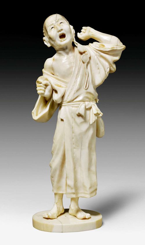 AN IVORY OKIMONO OF A YAWNING MAN. Japan, Meiji peiod, height 22 cm. Restored, crack in the base. Engraved signature.
