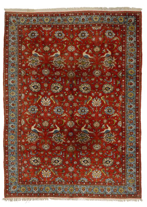 GHOM old.Red ground, patterned throughout with trailing flowers, palmettes and birds, light blue border, 225x330cm.