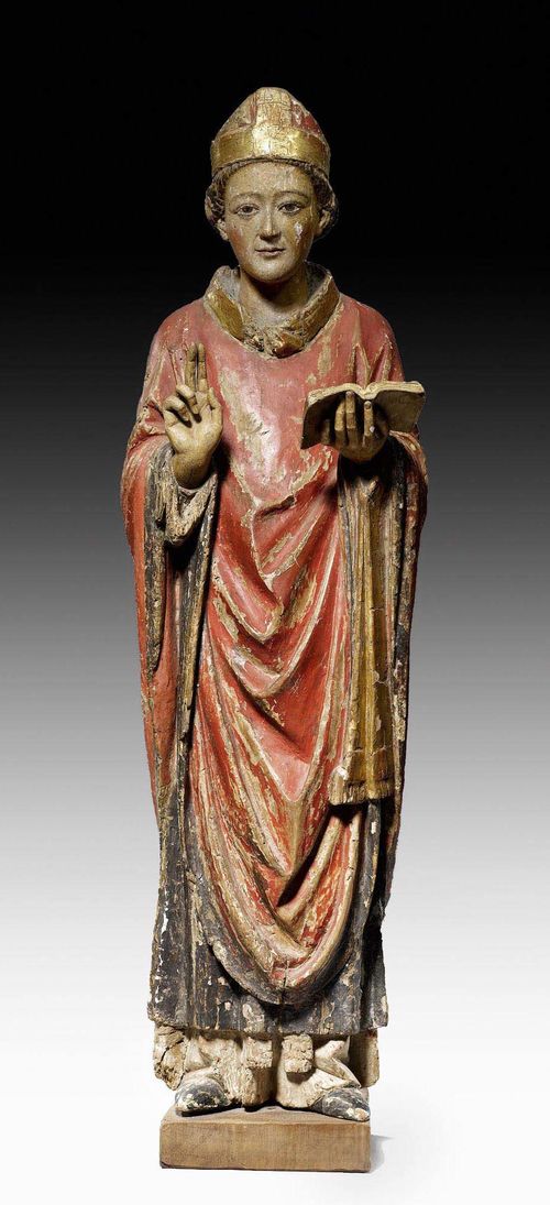FIGURE OF A BISHOP,probably Italy, 15th/16th century. Limewood carved full round and painted. H without later square plinth 74 cm. Paint rubbed, retouched in parts. Both hands later.
