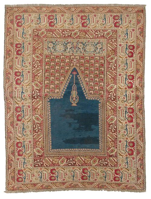 GHIORDES PRAYER antique.Blue mihrab with green spandrels, white border with pomegranates, restored in some areas, slight wear, 140x177 cm.