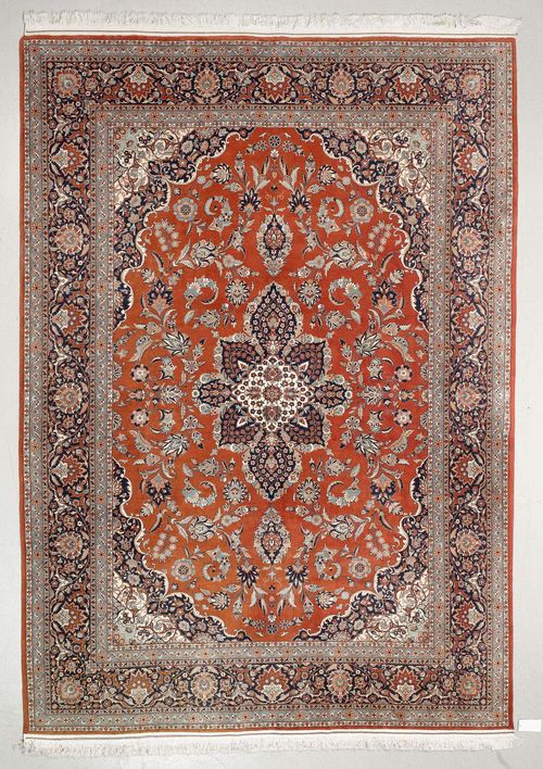 GHOM.Rust-coloured central field with a central medallion, patterned with trailing flowers and palmettes, black border with trailing flowers, 240x350 cm.