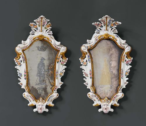 PAIR OF MAJOLICA MIRRORS, late Louis XV, Bassano, 19th century. Majolica painted with flowers, leaves and a mascaron. Fine old mirror glass with depictions of a man and a woman standing. 1 mirror glass chipped. H 68 cm.