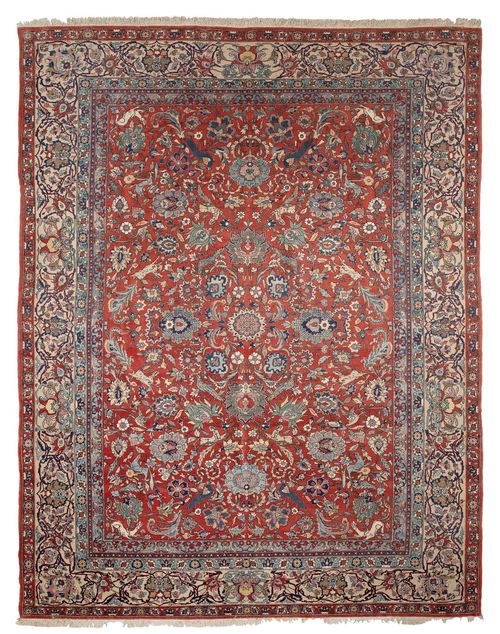 ISFAHAN old.Rust coloured central field, patterned throughout with trailing flowers, palmettes and animals in delicate pastel colours, beige border with trailing flowers, slight signs of wear, 285x430 cm.