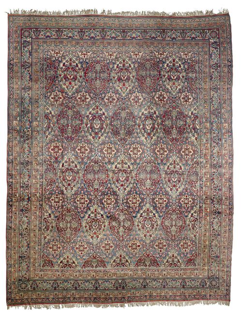 KIRMAN antique.Colourful central field, patterned throughout with floral medallions in delicate pastel colours, wide, stepped border with trailing flowers, 420x550 cm.