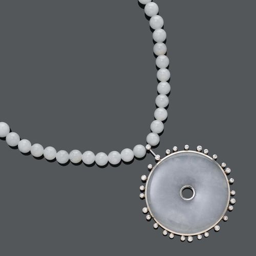 JADEITE AND DIAMOND NECKLACE, ca. 1982. White gold 750. A single strand of white "A"-jade beads of ca. 8,4 - 10 mm Ø. L ca. 72 cm. At the front side set with a round jade "PI"-pendant within a diamond frame, diamonds weighing ca. 1.40 ct. D ca. 5 cm.