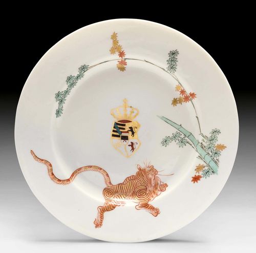 MEISSEN PLATE FROM THE JAPANESE PALACE IN DRESDEN, Meissen, ca. 1730. Painted in the Kakiemon style. With the royal coat-of-arms of Saxony in black, iron-red, green and gold, probably later. Overglaze blue sword mark and incised Johanneum number 'N=73-W' in black. D 21 cm. Provenance: - from the Royal Collections of Saxony, Japanese Palace in Dresden (since 1734). - Kunsthandel Röbbig, Munich. - Kunsthandel Caviglia, Lugano. - Koller Auctions, Zurich. - from a Zurich private collection.