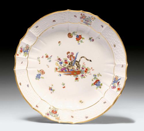 LARGE MEISSEN DISH WITH 'YELLOW LION' PATTERN, Meissen, ca. 1740. Painted with a tiger, the 'yellow lion', surrounded by flowering branches accentuated in gold, and insects, underglaze blue sword mark, press number 21 and press mark, D 34 cm. Provenance: - Koller Auctions, Zurich, 14 March 2005, Lot No. 1416. - from a Zurich private collection.