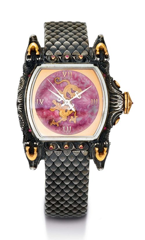 LES MILLIONNAIRES WRISTWATCH, "DRAGON" ca. 2013. Silver, stainless steel and pink gold. Tonneau-shaped silver case with dragons on all 4 sides, decorated with pink gold, pink and green tourmaline, and black diamonds. Cold ceramic dial with applied, pink gold dragons with small diamonds as eyes. Sword hands. Automatic, ETA Cal. 2824. Hand-made silver link band with double fold-over clasp. D 42 x 53 mm.
