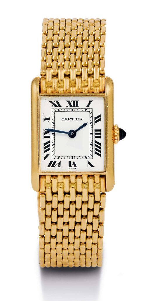 CARTIER TANK LADY'S WRISTWATCH, HAND WINDER, 1980s. Yellow gold 750. Rectangular, screwed case No. 671172497 with convex sapphire glass. Gold crown set with blue sapphire cabochon. White dial with black Roman numerals and blued hands. Flat hand winding calibre. Fine gold link band with invisible fold-over clasp. D 25 x 19 mm. With warranty certificate.