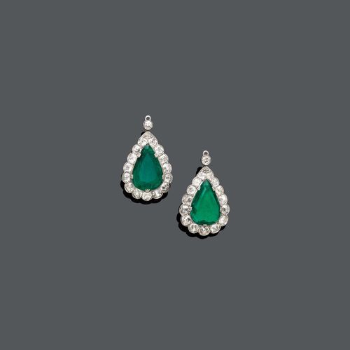 EMERALD AND DIAMOND PENDANTS, ca. 1910. Platinum. Two pear-shaped pendants for earrings set with 2 fine Columbian emeralds totalling ca. 8.00 ct, within a circular-cut diamonds surround of ca. 3.10 ct.