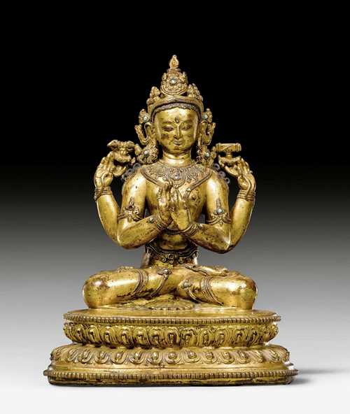 A GILT COPPER FIGURE OF PRAJNAPARAMITA WITH TURQUOISE INLAYS. Nepalese work in Tibet, 16th c. Height 24.5cm