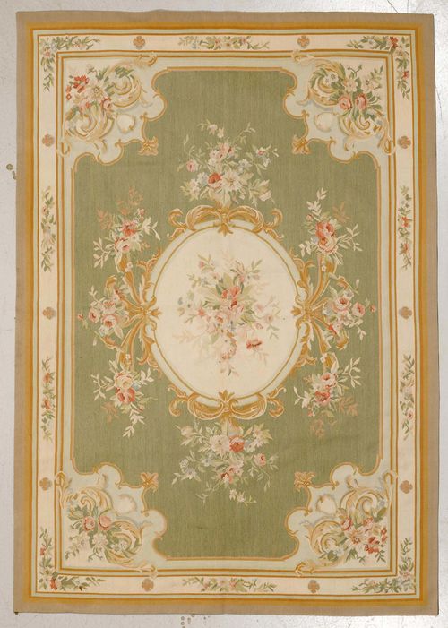 CHINA AUBUSSON.Light green central field with a floral central medallion and corner motifs, white edging, 185x270 cm.