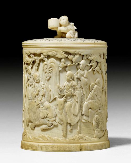 AN IVORY BOX WITH COVER CARVED WITH MONKS AND ANIMALS. Japan, Meiji period, H 15 cm.