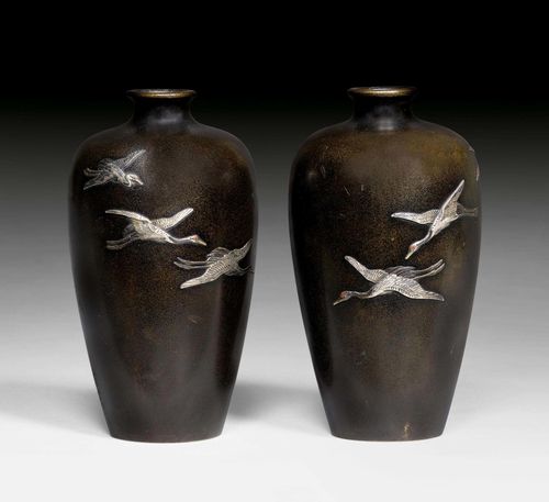 A PAIR OF SMALL BRONZE VASES INLAID WITH SILVER CRANES. Japan, Meiji period, height 11 cm. Nogawa mark, signed.