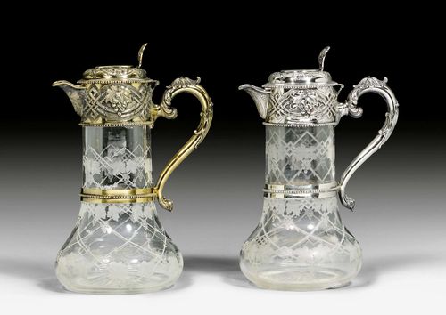 PAIR OF CARAFES,Sheffield 1870-1872. Cut glass carafe, mounted in silver and silver-gilt. H 26.5 cm.