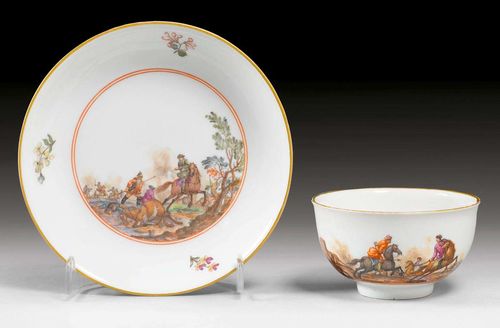 CUP AND SAUCER WITH BATTLE SCENES, Meissen, circa 1745.Gold edges. Underglaze blue sword marks, impressed numbers.