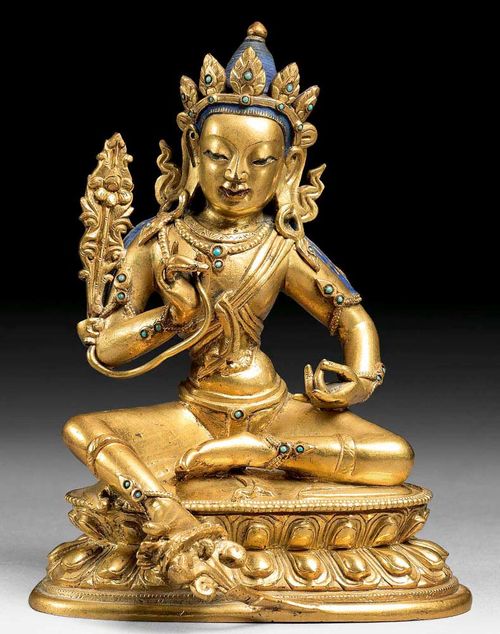 BODHISATTVA.Sino-Tibetan, 18th century  H 11.5 cm. Good gilding over bronze, with colour painting on the head. The necklace, arm and foot bands are set with glass stones. Plinth base lost.