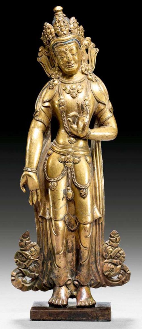 PADMAPANI.Nepal, 18/19th century  H 24 cm. Gilt copper alloy, with remains of old painting.
