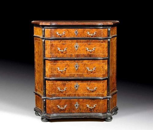 SMALL CHEST OF DRAWERS,early Baroque, Northern Italy circa 1700. Burl walnut and local fruitwoods in veneer, partly shaped and ebonised. With 5 drawers and bronze mounts. 78x38x84 cm.