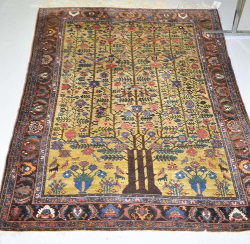 PERSIAN old.Light green central medallion with a tree of life, plants and animals in attractive pastel colours, brown border, slight wear, 155x200 cm.